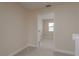 Neutral bedroom featuring carpeted floors and a window with bright sunlight at 19123 Sunset Bay Dr, Land O Lakes, FL 34638