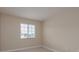 Bright bedroom with carpeted floors and a window at 19123 Sunset Bay Dr, Land O Lakes, FL 34638