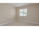Neutral bedroom featuring carpeted floors and a window at 19123 Sunset Bay Dr, Land O Lakes, FL 34638