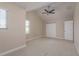 Bright bedroom with vaulted ceiling, carpeted floor, and ceiling fan at 19123 Sunset Bay Dr, Land O Lakes, FL 34638