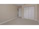 Bedroom featuring plush carpeting, a spacious closet, and openings to other parts of the home at 19123 Sunset Bay Dr, Land O Lakes, FL 34638
