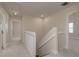 Bright hallway with neutral carpet, white trim, and access to multiple rooms at 19123 Sunset Bay Dr, Land O Lakes, FL 34638