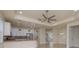 Open-concept kitchen features granite countertops, stainless steel appliances, and pendant lighting at 19123 Sunset Bay Dr, Land O Lakes, FL 34638