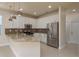 Beautiful kitchen with stainless steel appliances, granite countertops, and stylish pendant lighting at 19123 Sunset Bay Dr, Land O Lakes, FL 34638