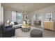 Comfortable living room with stylish furniture, neutral tones, and an open layout for easy entertaining at 19123 Sunset Bay Dr, Land O Lakes, FL 34638
