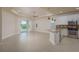 Living space featuring tile floors, ceiling fan, sliding glass doors and a great view of the lake at 19123 Sunset Bay Dr, Land O Lakes, FL 34638