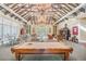 Lobby area with a billiard table, comfortable seating, and dining tables, great for recreation and socializing at 19123 Sunset Bay Dr, Land O Lakes, FL 34638