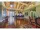 Inviting lobby area with wood floors, high ceilings, elegant light fixtures, and seating for residents and guests at 19123 Sunset Bay Dr, Land O Lakes, FL 34638