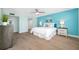 Light-filled bedroom featuring wood floors, soothing colors and stylish decor at 19531 Gulf Blvd # 404, Indian Shores, FL 33785