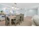 Open concept dining area with view to the modern, well-equipped kitchen at 19531 Gulf Blvd # 404, Indian Shores, FL 33785