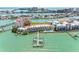 Expansive aerial view of a waterfront townhouse community with a private pool and docks at 200 Brightwater Dr # 10, Clearwater Beach, FL 33767