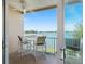 Inviting balcony with seating offering stunning views of the water at 200 Brightwater Dr # 10, Clearwater Beach, FL 33767