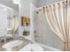 Bathroom featuring a granite vanity, toilet, and a tub with a shower, creating a relaxing atmosphere at 200 Brightwater Dr # 10, Clearwater Beach, FL 33767