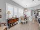 Bright dining area with plantation shutters and hardwood dining table at 200 Brightwater Dr # 10, Clearwater Beach, FL 33767