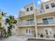 Multi-story home with white balconies, spiral staircases and waterfront views at 200 Brightwater Dr # 10, Clearwater Beach, FL 33767