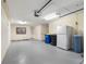 A spacious garage with neutral paint, storage and two doors at 200 Brightwater Dr # 10, Clearwater Beach, FL 33767