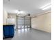Spacious garage with ample storage and a neutral color scheme at 200 Brightwater Dr # 10, Clearwater Beach, FL 33767