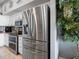 Kitchen with stainless steel refrigerator and adjacent to pantry at 200 Brightwater Dr # 10, Clearwater Beach, FL 33767
