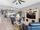 Bright living room featuring tile floors, ceiling fan, and adjacent open-plan kitchen at 200 Brightwater Dr # 10, Clearwater Beach, FL 33767