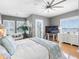 Bright main bedroom with water views, hardwood floors, and sitting area at 200 Brightwater Dr # 10, Clearwater Beach, FL 33767