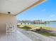 Covered patio offers waterfront views and a relaxing outdoor living space at 200 Brightwater Dr # 10, Clearwater Beach, FL 33767