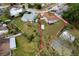 This aerial shot of the property outlined in red reveals a large lot within a tranquil residential community at 217 Regal Park Dr, Valrico, FL 33594