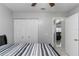 Bedroom with standard closet, neutral walls, and tile floors at 217 Regal Park Dr, Valrico, FL 33594