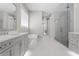 Luxurious primary bathroom with a soaking tub, walk-in shower, and dual vanities at 2316 S Thixton Ct, Tampa, FL 33629