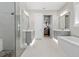 Spacious primary bathroom with a separate shower, soaking tub, and dual sinks at 2316 S Thixton Ct, Tampa, FL 33629