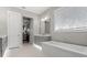 Bright bathroom featuring a soaking tub, vanity with marble countertop, and natural light at 2316 S Thixton Ct, Tampa, FL 33629