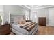 Inviting bedroom with a king-size bed, bedside tables, and view of the bathroom at 2316 S Thixton Ct, Tampa, FL 33629