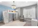 A bedroom with a lofted bed, chandelier, chair, and carpet providing a cozy retreat at 2316 S Thixton Ct, Tampa, FL 33629