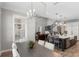 Spacious kitchen with an island, stainless steel appliances, and views of the living room at 2316 S Thixton Ct, Tampa, FL 33629