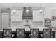 Bright kitchen with large island, stainless appliances, modern lighting and seating at 2316 S Thixton Ct, Tampa, FL 33629