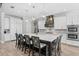 Bright kitchen with large island, stainless appliances, modern lighting and seating at 2316 S Thixton Ct, Tampa, FL 33629