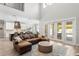 Open concept space with high ceilings, wood floors, and seamless flow to the kitchen at 2316 S Thixton Ct, Tampa, FL 33629