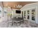 Enjoy outdoor living with a kitchen, bar, grill, dining area, and television at 2316 S Thixton Ct, Tampa, FL 33629