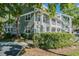 Charming condo complex with light green siding and well maintained shrubbery at 2599 Dolly Bay Dr # 209, Palm Harbor, FL 34684