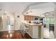 Open concept kitchen features counter seating, updated appliances, and tile flooring at 2599 Dolly Bay Dr # 209, Palm Harbor, FL 34684