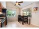 Eat-in kitchen features a vaulted ceiling and views of mature trees at 2599 Dolly Bay Dr # 209, Palm Harbor, FL 34684