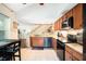 Kitchen featuring granite countertops, stainless appliances, and tile flooring at 2599 Dolly Bay Dr # 209, Palm Harbor, FL 34684
