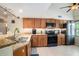 Kitchen features granite countertops, updated appliances, and vaulted ceilings at 2599 Dolly Bay Dr # 209, Palm Harbor, FL 34684