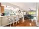Open floor plan featuring hardwood floors connects living room to kitchen at 2599 Dolly Bay Dr # 209, Palm Harbor, FL 34684