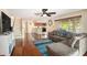 Spacious living room featuring hardwood floors and sliding door access to patio at 2599 Dolly Bay Dr # 209, Palm Harbor, FL 34684