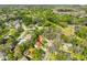 Aerial view of a well-maintained neighborhood with tree-lined streets, pools, and lush landscaping at 2812 Ormandy Ct, Tampa, FL 33618