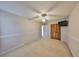 Bedroom features carpet, modern paint color, wall mounted TV, and closet for maximum storage at 2812 Ormandy Ct, Tampa, FL 33618