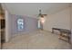 Generous bedroom with carpet, ample natural light from two windows, a ceiling fan, and a spacious layout at 2812 Ormandy Ct, Tampa, FL 33618