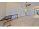 Bedroom with neutral carpet, ceiling fan, and doorway leading to an adjacent room at 2812 Ormandy Ct, Tampa, FL 33618