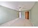 Light and airy bedroom featuring carpet floors, ceiling fan, and closet for ample storage at 2812 Ormandy Ct, Tampa, FL 33618