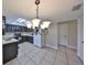Well-lit kitchen featuring ample countertop space, black cabinetry, and tile flooring at 2812 Ormandy Ct, Tampa, FL 33618